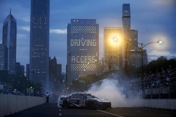 CHICAGO, ILLINOIS - JULY 02: Shane Van Gisbergen, driver of the #91 Enhance Health Chevrolet, celebrates with a burnout after winning the NASCAR Cup Series Grant Park 220 at the Chicago Street Course on July 02, 2023 in Chicago, Illinois. (Photo by Jared C. Tilton/Getty Images)