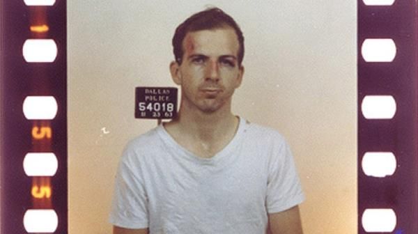 color mug shot of Lee Harvey Oswald